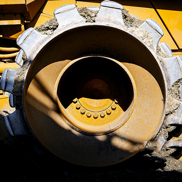 Какую роль играет звездочка в горнодобывающем экскаваторе?